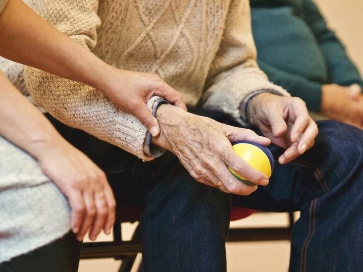 an elderly man doing physio