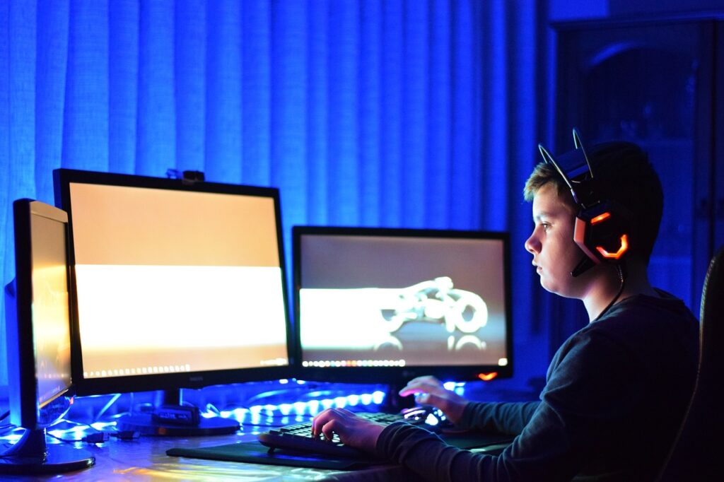 a child playing a video game with a headset on their head.