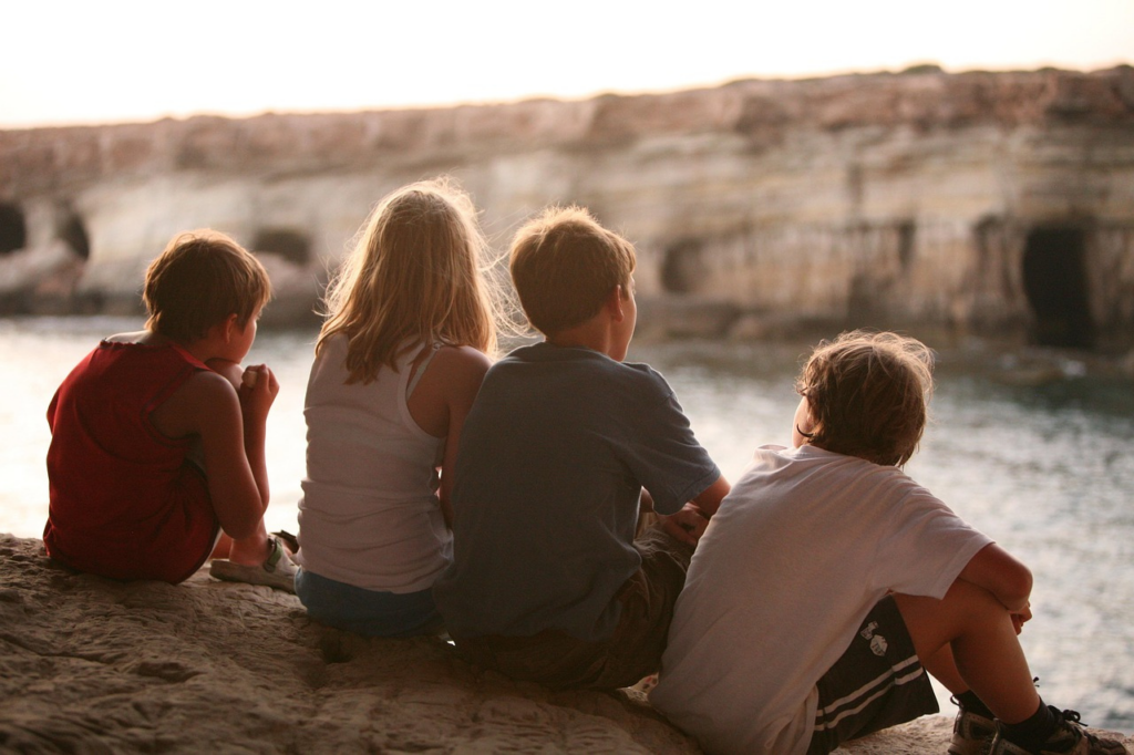 Young people sitting down.