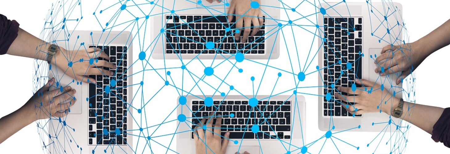 Four keyboards with hands typing with connected webs above them.