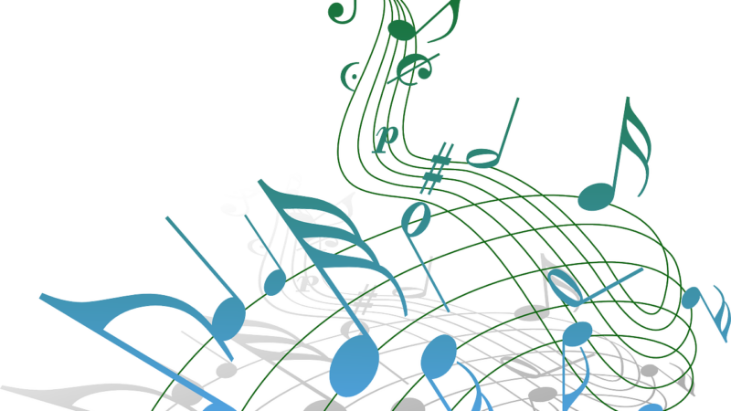 blue and green music notes floating through the air